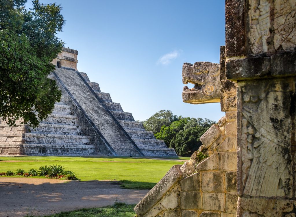 Jaguar head and Mayan Temple pyramid of Kukulkan - Chichen Itza, Yucatan, Mexico